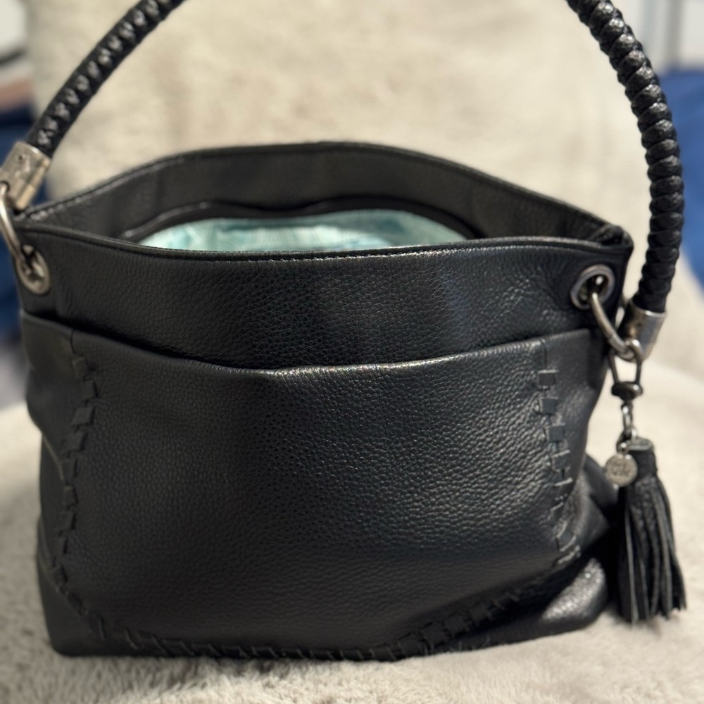 The Sak Black Leather Braided Handle Shoulder Bag with Tassel